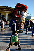 Myanmar - Kyaikhtiyo, porters carrying luggage's of the pilgrims. 